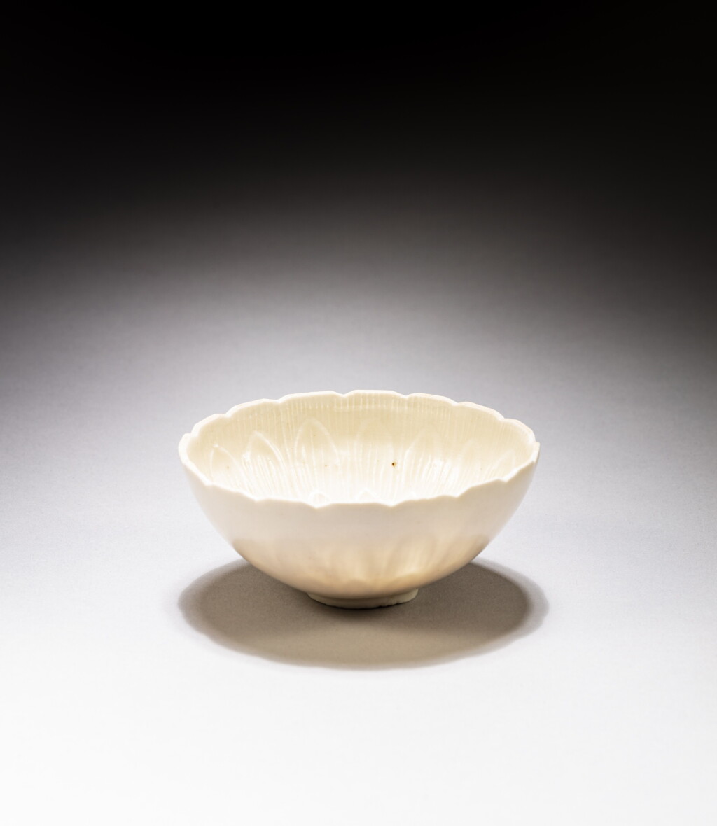 View full screen - View 1 of Lot 25. A 'Ding'-type 'lotus' bowl, probably Song dynasty | 或宋 定窰系白釉花口盌.