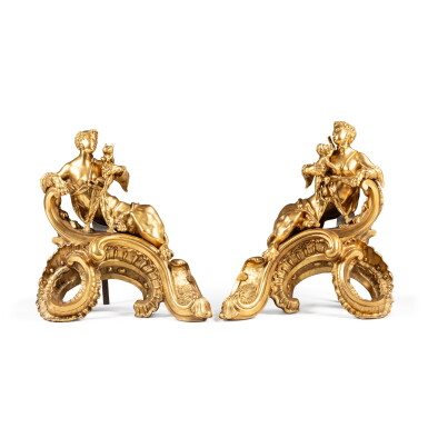 View full screen - View 1 of Lot 222. A pair of Régence style gilt-bronze firedogs, the model attributed to Charles Cressent | Paire de chenets en bronze doré de style Louis XV, le modèle attribué à Charles Cressent.