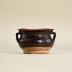 A small black-glazed handled jar, Jin - Yuan dynasty | 金至元 黑釉雙繫小罐