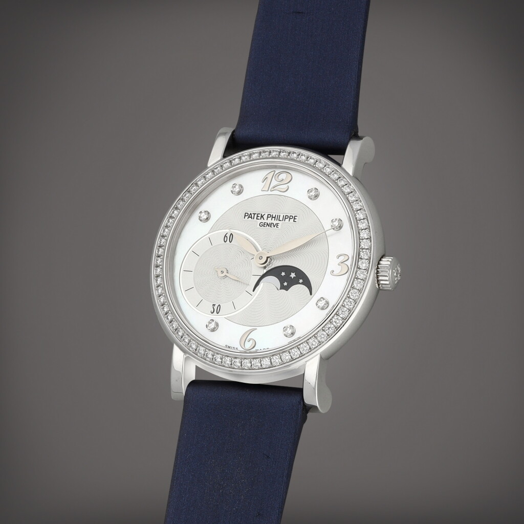View full screen - View 1 of Lot 44. Calatrava, Reference 4958G-001 | A white gold and diamond-set wristwatch with moon phases and mother of pearl dial | Circa 2007.