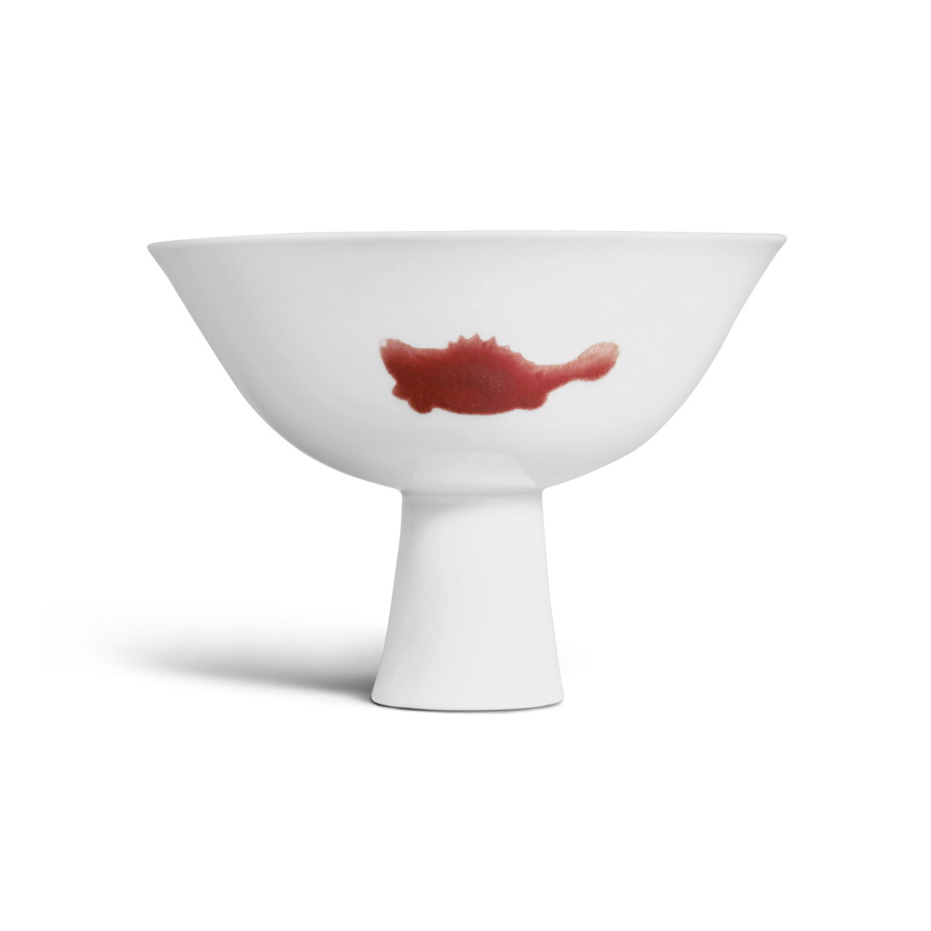 View full screen - View 1 of Lot 261. A Ming-style copper-red decorated 'three fish' stembowl, Mark and period of Yongzheng | 清雍正 釉裏紅三魚紋高足盌 《大清雍正年製》款.