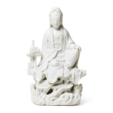 View full screen - View 1 of Lot 1032. A 'DEHUA' FIGURE OF GUANYIN SEATED WITH A VASE AND SCROLLS, QING DYNASTY, 18TH CENTURY.