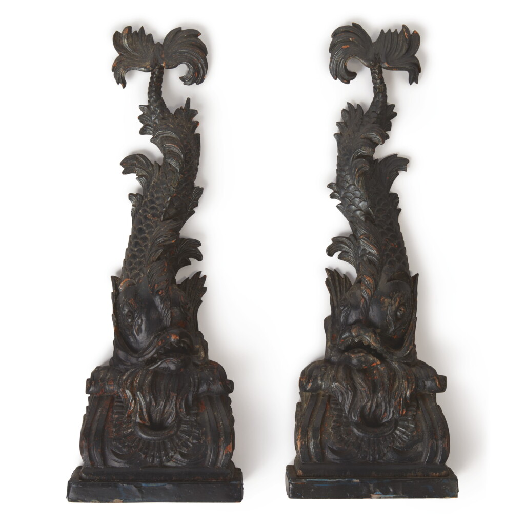 View full screen - View 1 of Lot 19. A PAIR OF CARVED EBONIZED WOOD DOLPHIN BRACKETS.