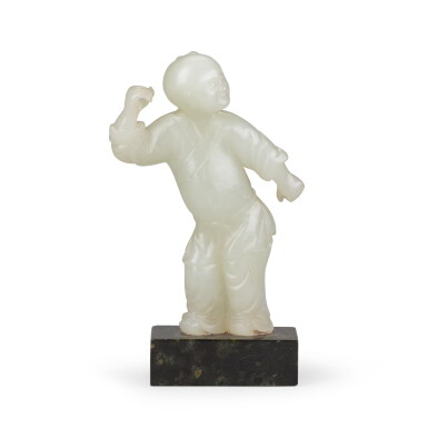 View full screen - View 1 of Lot 56. A pale celadon jade figure of a boy Qing dynasty, 18th century | 清十八世紀 青白玉童子立像.