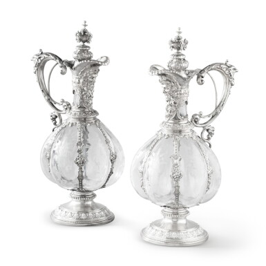 View full screen - View 1 of Lot 890. A pair of large German silver-mounted cut-glass claret jugs, probably Fauser & Grupp, circa 1890 .