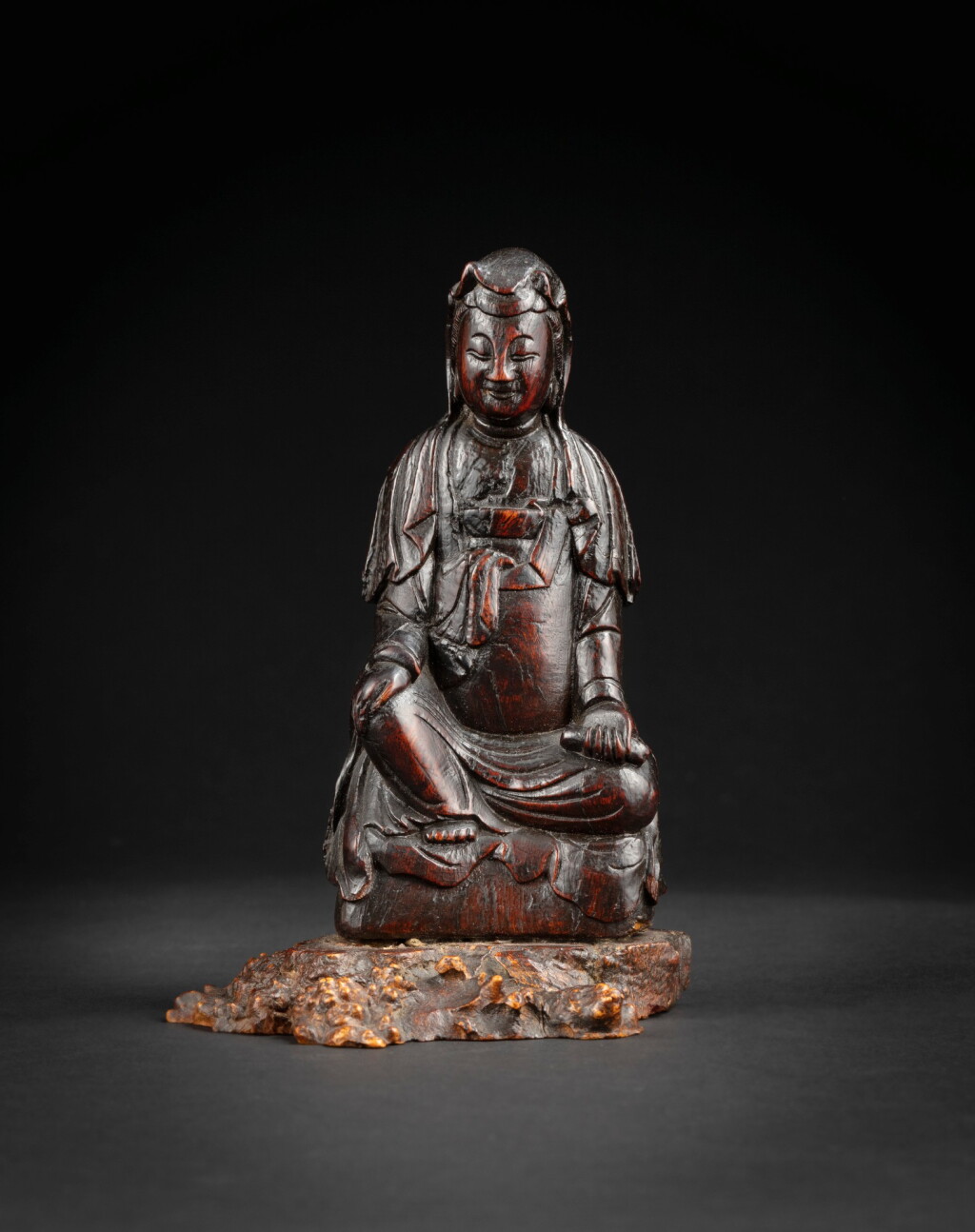 View full screen - View 1 of Lot 47. A rare chenxiangmu Guanyin 17th-18th century | 十七至十八世紀 沉香木雕觀音坐像.