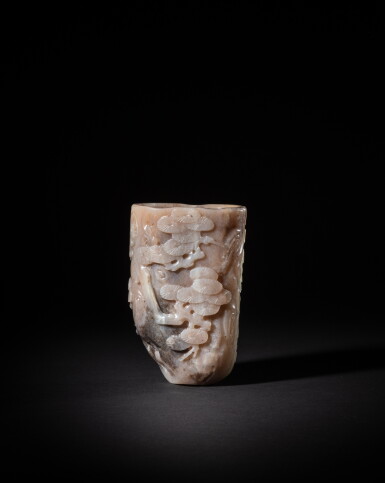 View full screen - View 1 of Lot 226. A pale jade 'pine trunk' rhyton, Qing dynasty, Qianlong period | 清乾隆 清白玉蒼松紋首盃.