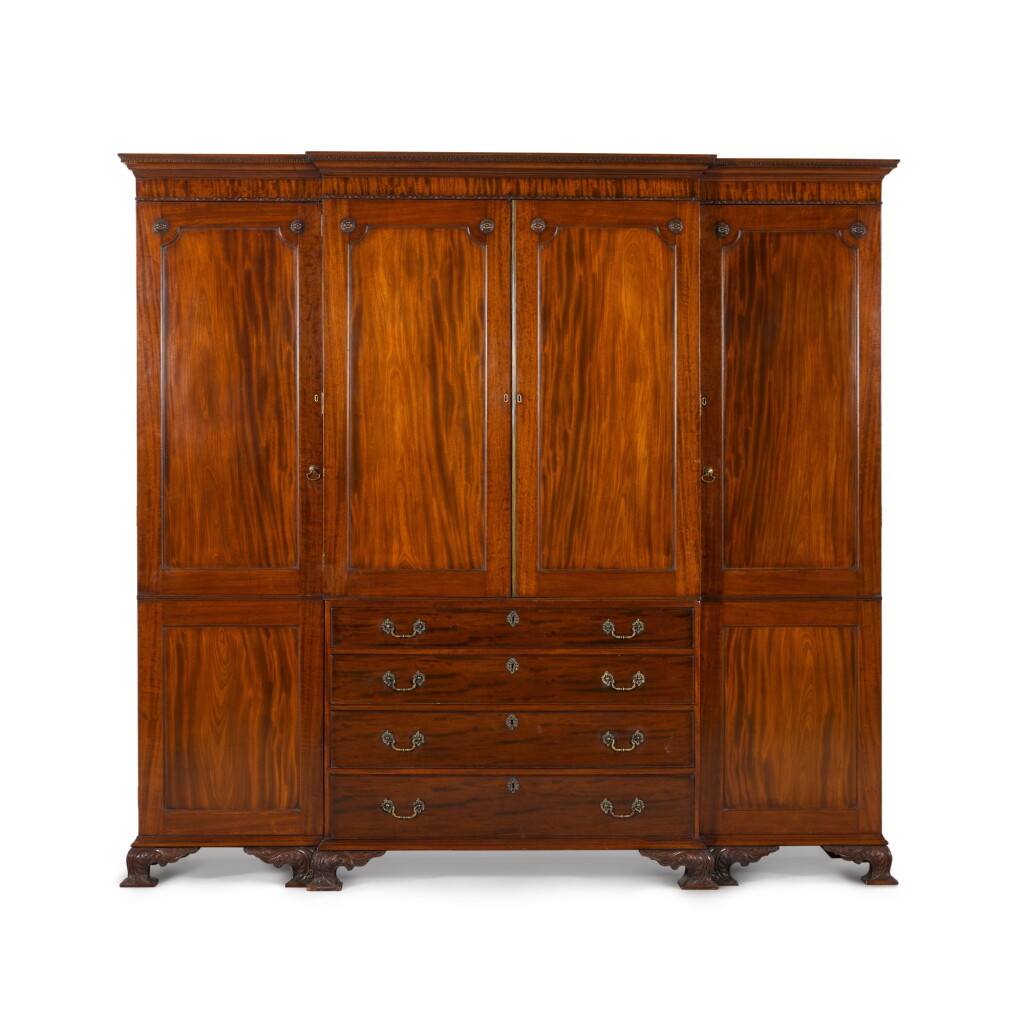 View full screen - View 1 of Lot 80. A late George III mahogany breakfront wardrobe, first quarter 19th century.