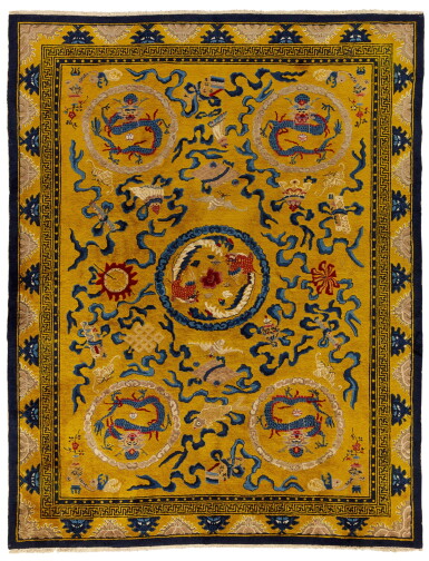 View full screen - View 1 of Lot 107. A large yellow-ground 'dragon' medallion carpet, Late Qing dynasty | 清末 黃地龍鳳呈祥紋絲絨地毯.