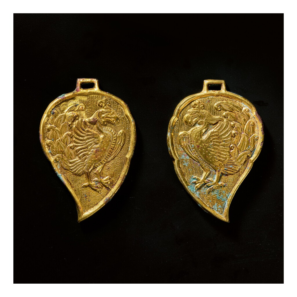 View full screen - View 1 of Lot 598. A PAIR OF LEAF-FORM GILT-BRONZE 'PHOENIX' PLAQUES, LIAO DYNASTY.