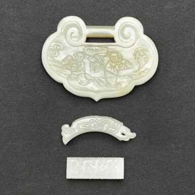 View full screen - View 1 of Lot 563. THREE ARCHAISTIC WHITE JADE ORNAMENTS QING DYNASTY | 清 白玉珮飾一組三件.
