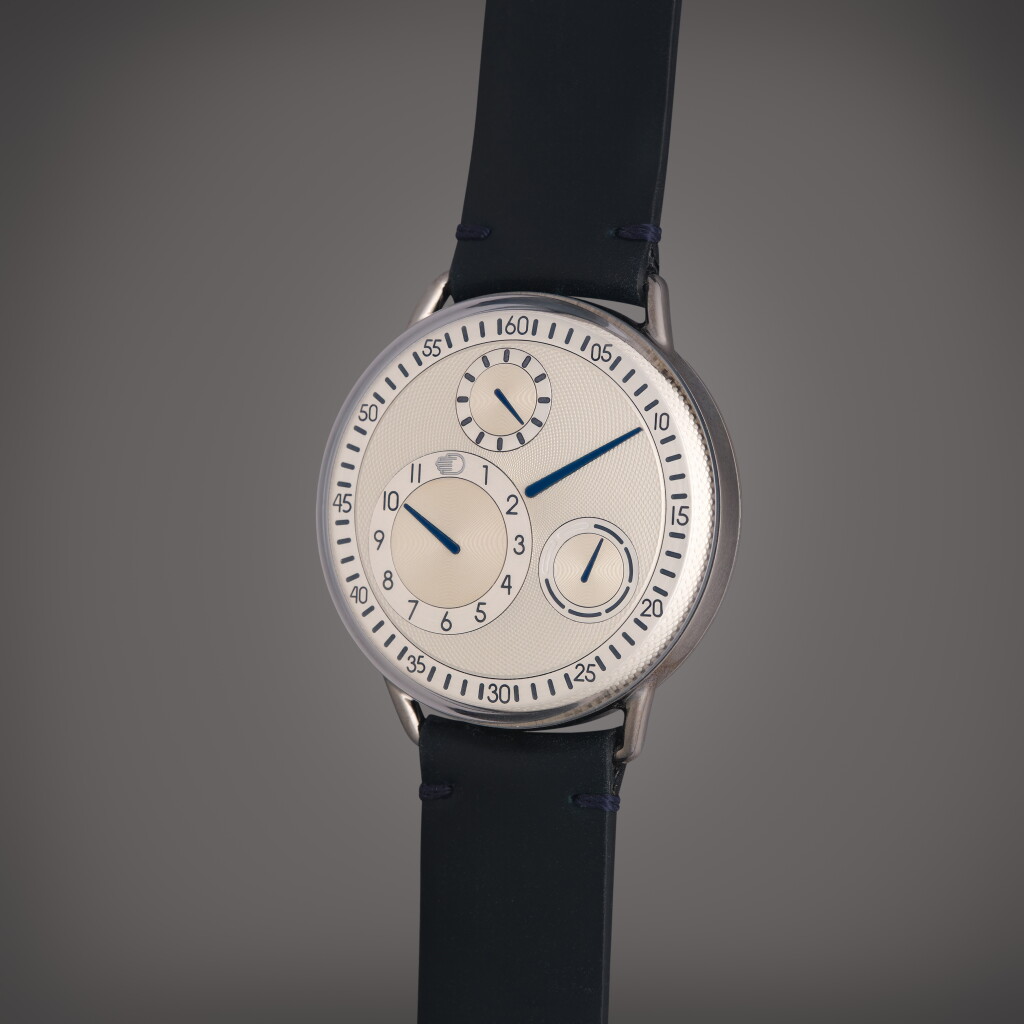 View full screen - View 1 of Lot 577. Type 1R | A titanium automatic wristwatch with rotating dial and day of the week indication, Circa 2018.