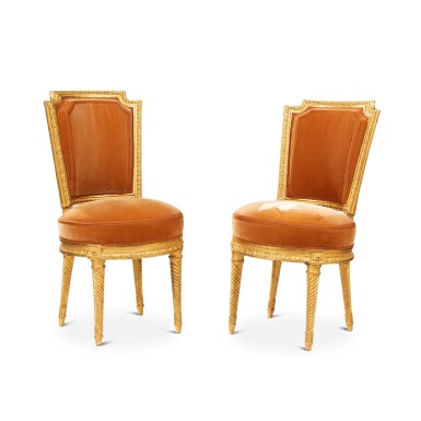 View full screen - View 1 of Lot 576. A pair of Louis XVI chaises en cabriolet, late 18th century, attributed to Georges Jacob.