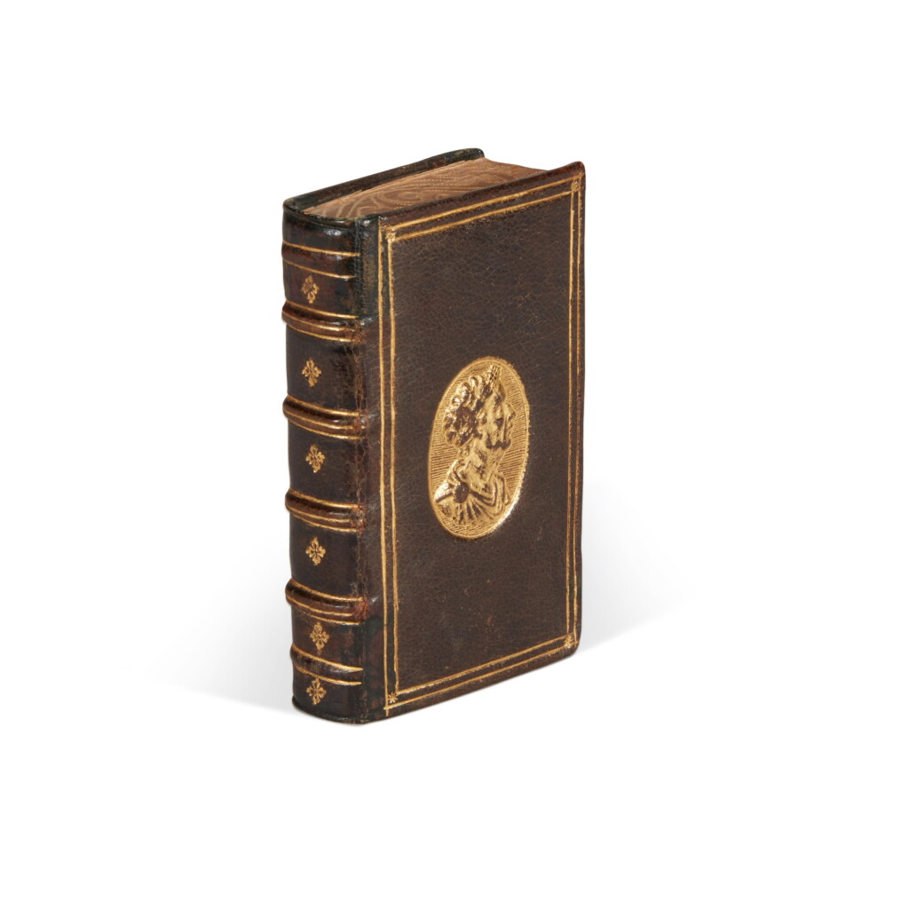 View full screen - View 1 of Lot 1683. Ficino, De vita libri tres, Lyon, 1560, contemporary brown morocco for Marcus Fugger, with gilt medallion stamp of Julius Caesar.