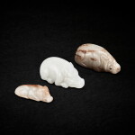A group of three jade pigs, Ming dynasty or earlier - Qing dynasty 明或以前至清 玉豬一組三件