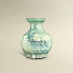 A green-glazed 'mask' vase, hu, Han dynasty | 漢 綠釉鋪首耳壺