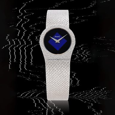 View full screen - View 1 of Lot 19. Reference 9081 B 56 | A white gold bracelet watch with onyx and lapis lazuli dial | Circa 1970.