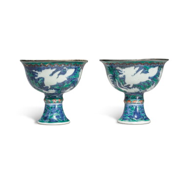 View full screen - View 1 of Lot 132. An extremely rare pair of blue-ground iron-red and green-enameled 'mythical beasts' stem cups, Marks and period of Wanli.