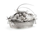 A large Italian silver centretable shaped as a fishing basket, Mario Buccellati, circa 1960 | Grand centre de table en forme de panier de pêche en argent par Mario Buccellati, Milan, vers 1960