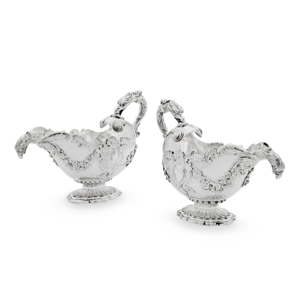 View full screen - View 1 of Lot 29. A Pair of George II Silver Eagle-Head Sauce Boats with Matching Ladles, Isaac Duke, London, 1747.