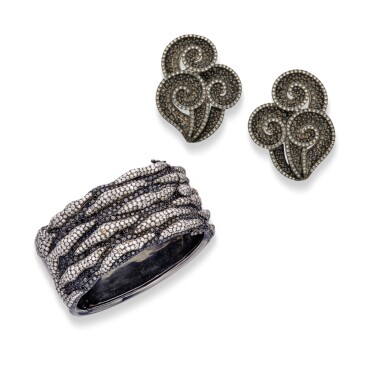 View full screen - View 1 of Lot 133. Diamond and Black Diamond Cuff-Bracelet and Pair of Earclips.