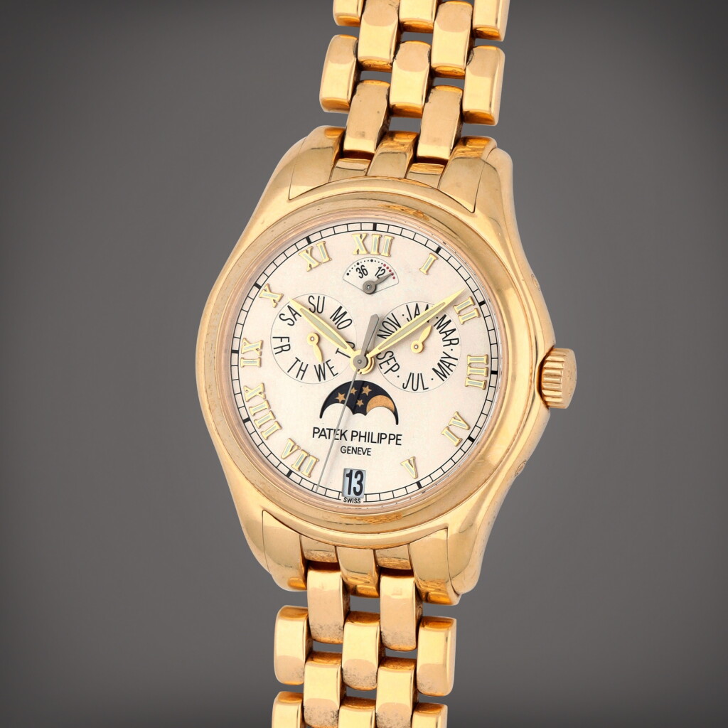 View full screen - View 1 of Lot 206. Reference 5036/1J-001 | A yellow gold annual calendar wristwatch with moon phase, power reserve indication and bracelet | Circa 2002.