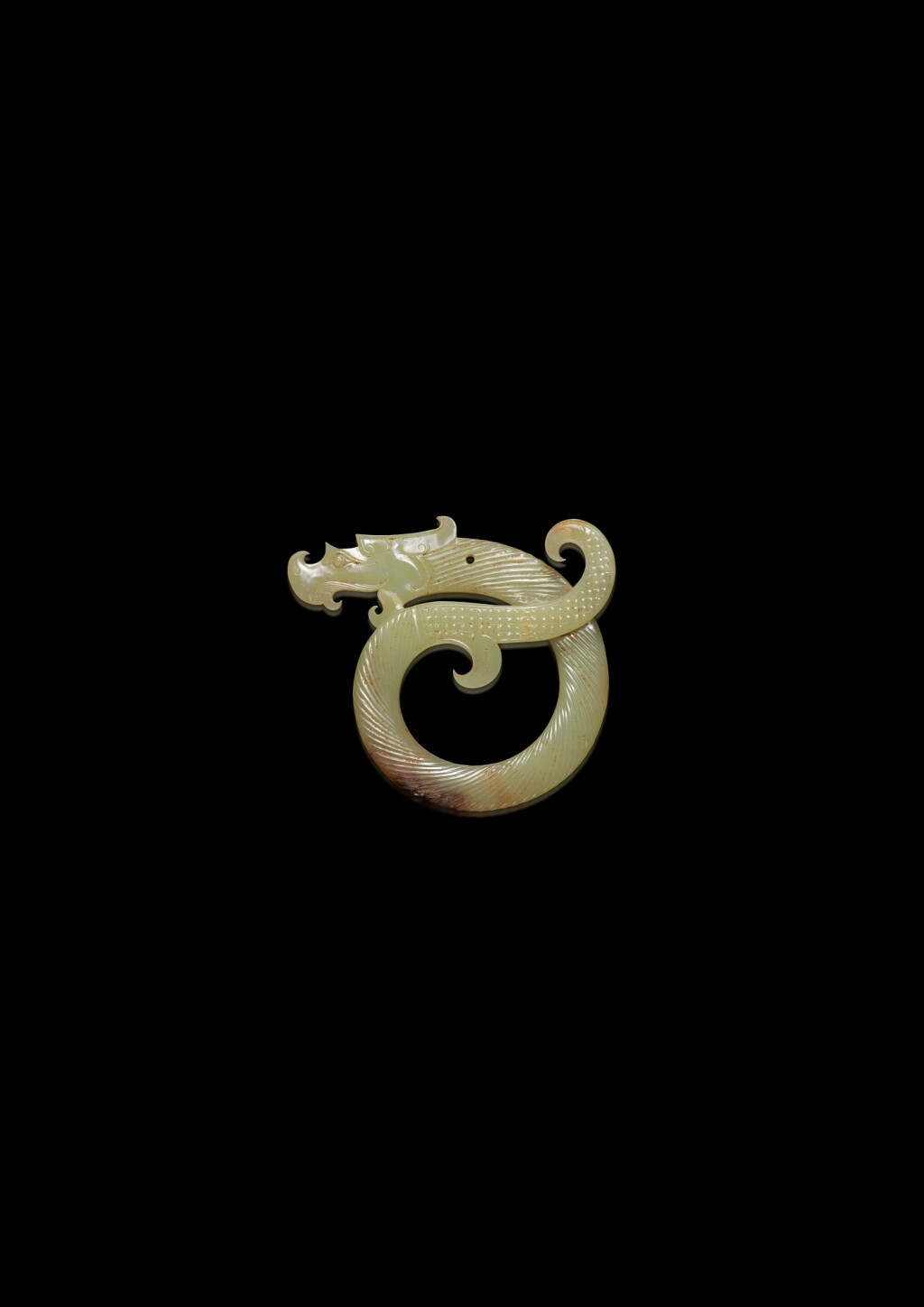 View full screen - View 1 of Lot 3611. A rare yellowish-celadon jade 'dragon' pendant, Late Warring States period | 戰國晚期 青黃玉卷龍扭絲紋珮.