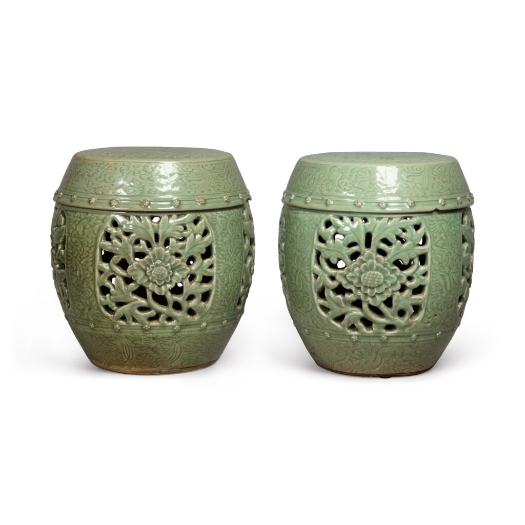 View full screen - View 1 of Lot 789. A pair of pierced and carved 'Longquan' celadon-glazed garden seats, Ming dynasty | 明 龍泉窰青釉開光鏤空花卉紋坐墩一對.
