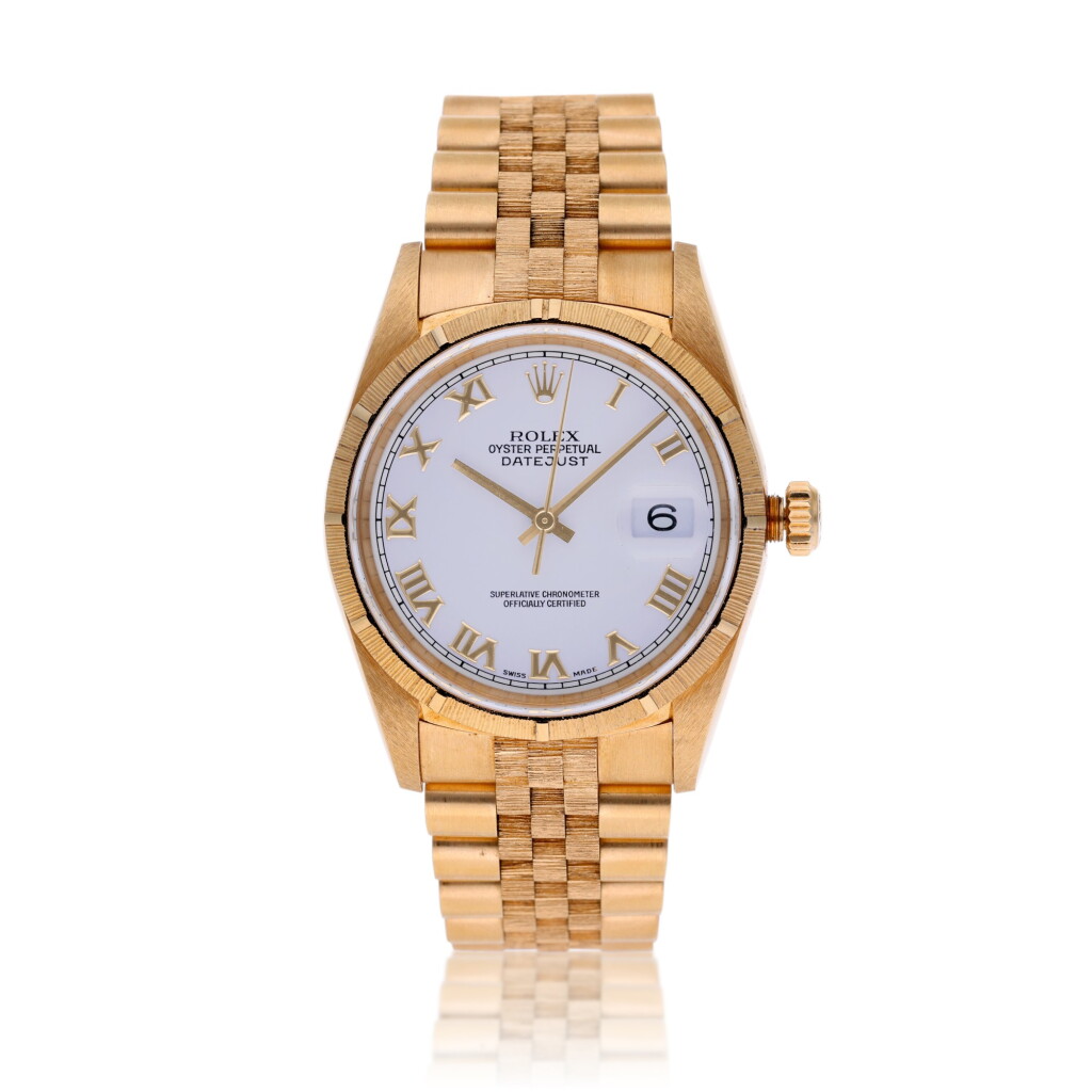 View full screen - View 1 of Lot 141. Reference 16248 Datejust, A yellow gold automatic wristwatch with date and bark bracelet, Circa 1998.