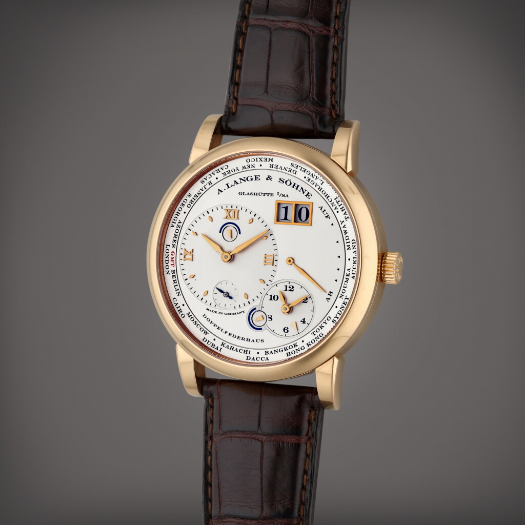 View full screen - View 1 of Lot 243. Reference 116.032 Lange 1 Time Zone | A pink gold world time wristwatch with date, power reserve and double day/night indication, Circa 2007.