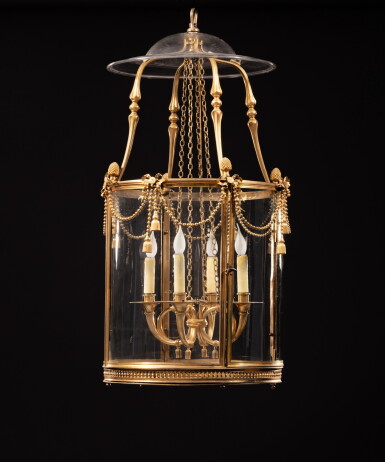 View full screen - View 1 of Lot 51. A large gilt-bronze circular lantern in the Louis XVI style, 19th century | Grande lanterne circulaire en bronze ciselé et doré de style Louis XVI, XIXeme siècle.