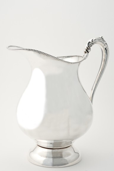 View full screen - View 1 of Lot 62. AN AMERICAN SILVER-PLATED WATER PITCHER.