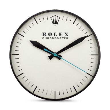 View full screen - View 1 of Lot 8128. THE OHIO ADVERTISING DISPLAY CO. FOR ROLEX | REFERENCE G-062, A LARGE BLACKENED METAL WALL CLOCK, CIRCA 1965.