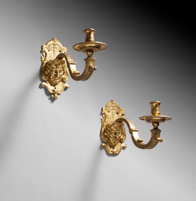 View full screen - View 1 of Lot 20. A pair of French Régence giltbronze wall-lights, circa 1720 | Paire d'appliques au masque en bronze doré d'époque Régence, vers 1720.