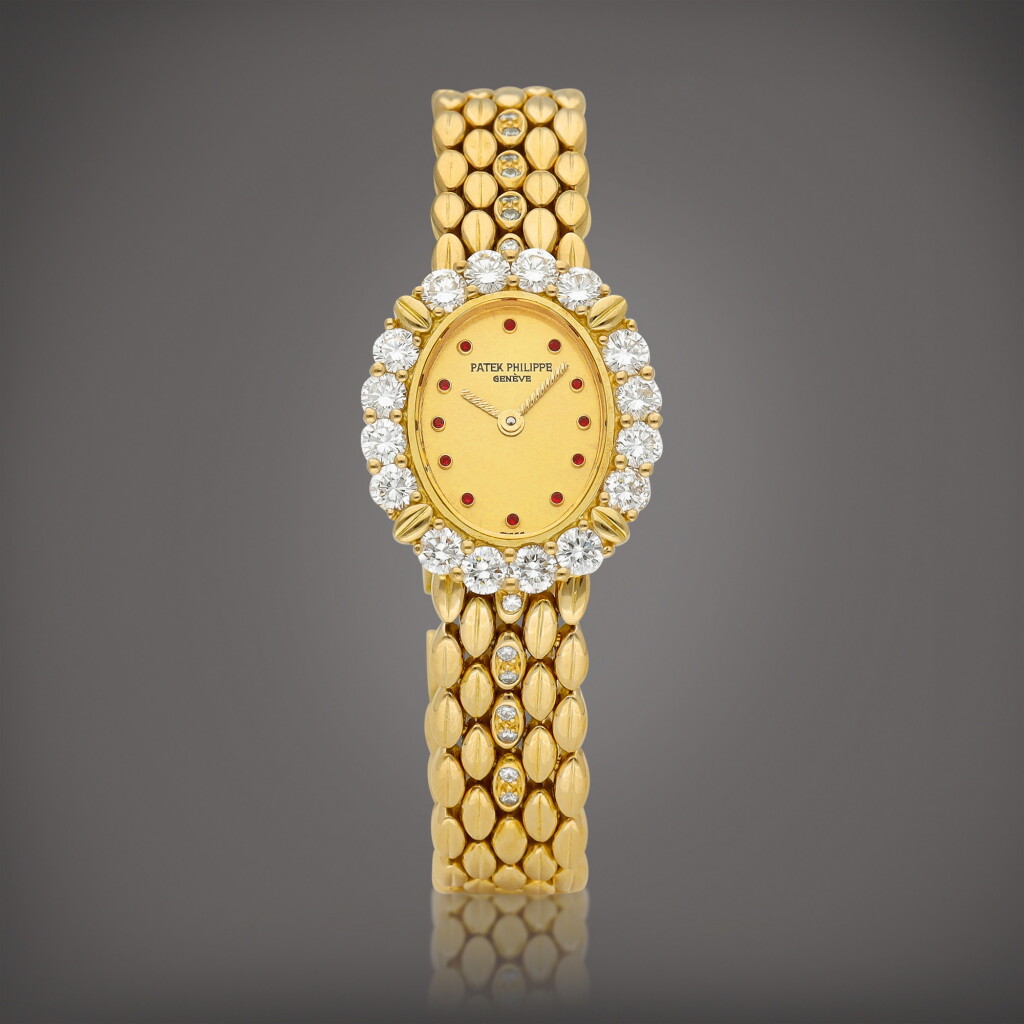 View full screen - View 1 of Lot 8806. Reference 4754 | A yellow gold, diamond and ruby-set bracelet watch, Circa 1985 | 百達翡麗 | 型號4754 | 黃金鑲鑽石及紅寶石鏈帶腕錶,約1985年製.
