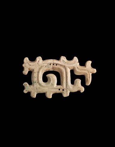View full screen - View 1 of Lot 904. A large calcified jade 'cloud' pendant, Neolithic period, Hongshan culture | 新石器時代 紅山文化 勾雲形玉飾.