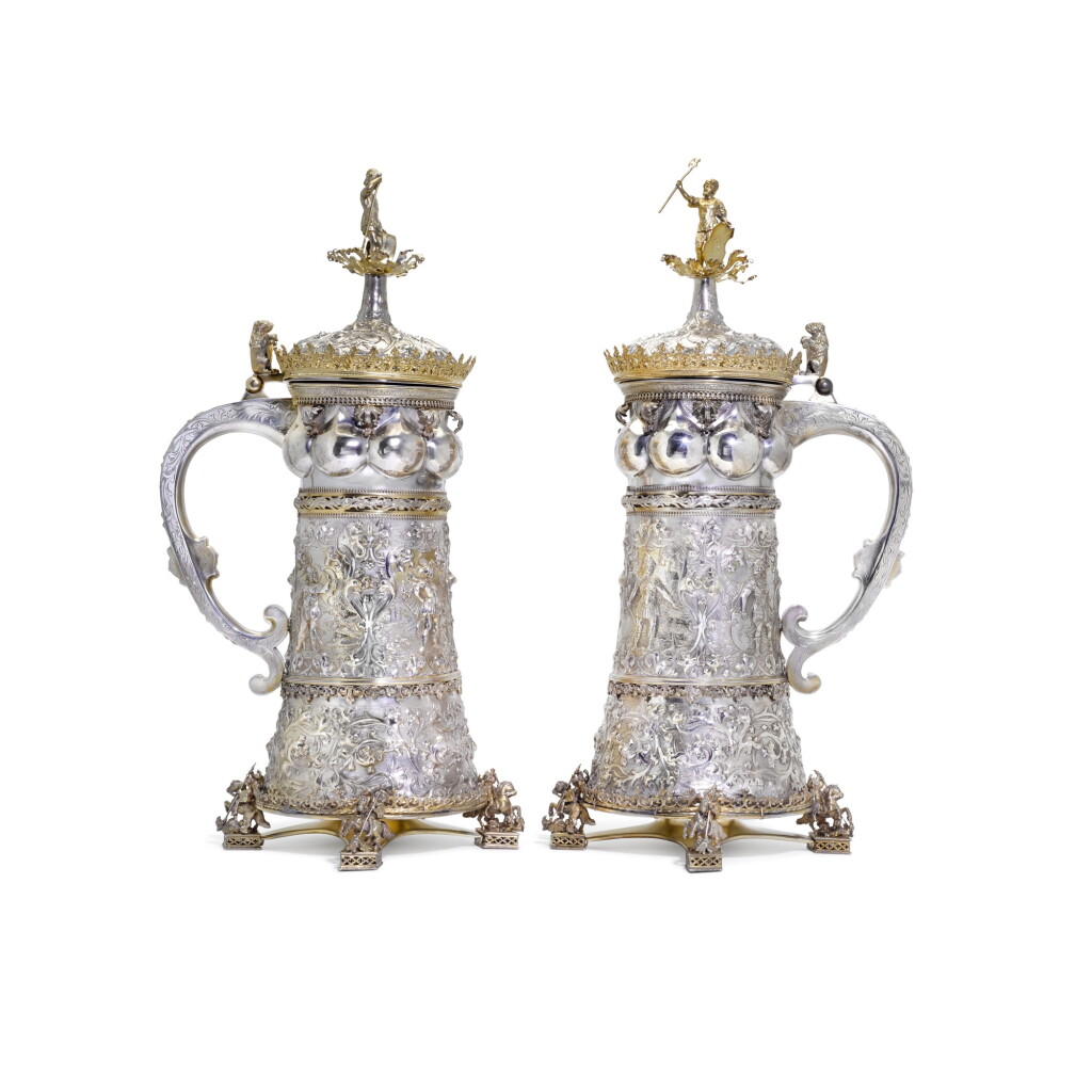 View full screen - View 1 of Lot 135. A MAGNIFICENT PAIR OF GERMAN PARCEL-GILT SILVER TANKARDS, RETAILED BY GORHAM CO., PROVIDENCE RI, CIRCA 1881.