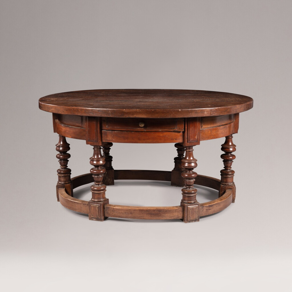 View full screen - View 1 of Lot 309. An oval walnut table, probably Bologna, second half of the 17th century | Table ovale en noyer, probablement Bologne, seconde moitié du XVIIeme siècle.
