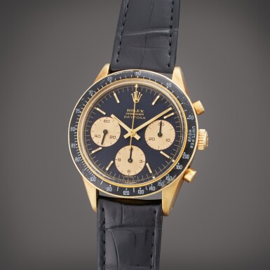 View full screen - View 1 of Lot 129. Reference 6241 ‘Jumbo Logo’ Daytona | A 14k yellow gold chronograph wristwatch with Nero dial, Circa 1966.