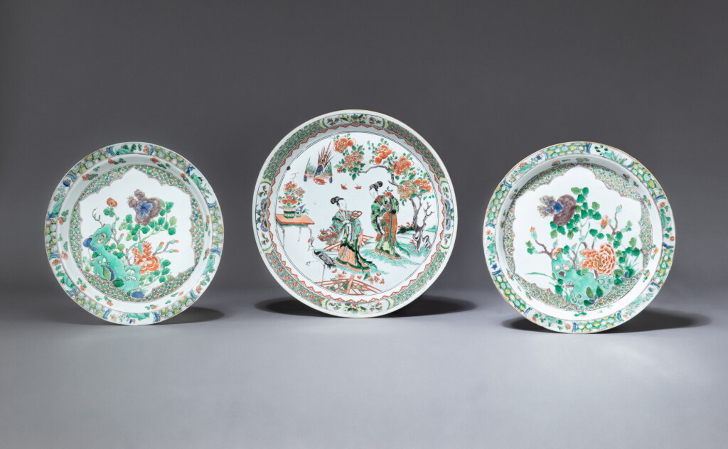 View full screen - View 1 of Lot 192. Two famille-verte 'peony' dishes and a wucai 'ladies' footed dish, Qing dynasty, Kangxi period | 清康熙 五彩牡丹紋盤及五彩仕女圖三足盤 一組三件.