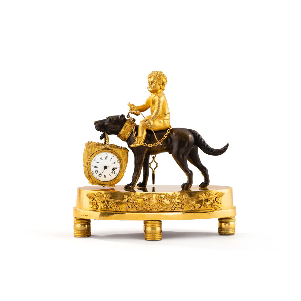 View full screen - View 1 of Lot 1070. An Empire patinated and gilt-bronze "Bacchus enfant" mantel clock, circa 1810 | Pendulette "Bacchus enfant" en bronze patiné et doré d'époque Empire, vers 1810.