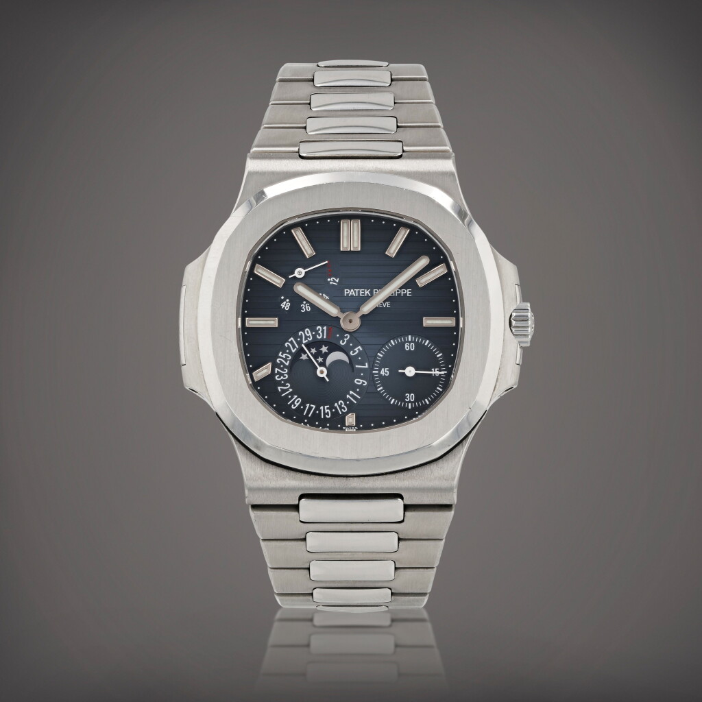 View full screen - View 1 of Lot 104. Nautilus, reference 5712/1A-001 Montre bracelet en acier avec date, phases de lune et indication de la réserve de marche | Stainless steel wristwatch with date, moon phases, power reserve indication and bracelet Vers 2015 | Circa 2015.