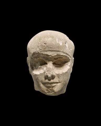 View full screen - View 1 of Lot 133. A Fragmentary Egyptian Limestone Head of a Man, Old Kingdom, probably 4th/5th Dynasty, 2640-2360 B.C., or 25th Dynasty, 750-656 B.C..