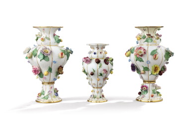 View full screen - View 1 of Lot 267. A pair of Messen porcelain flower and fruit encrusted baluster vases, circa 1860; and a similar smaller vase, circa 1840.