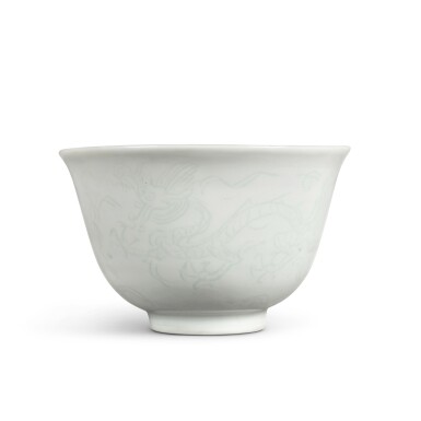 View full screen - View 1 of Lot 110. A fine incised white-glazed 'dragon' cup, Mark and period of Jiajing.
