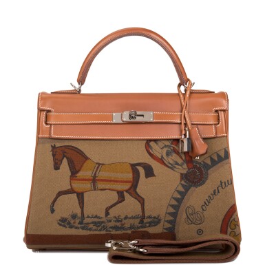 View full screen - View 1 of Lot 98. Hermès "Couvertures et Tenues de Jour" Retourne Kelly 32cm of Fauve Barenia Leather and Khaki Toile with Palladium Hardware.