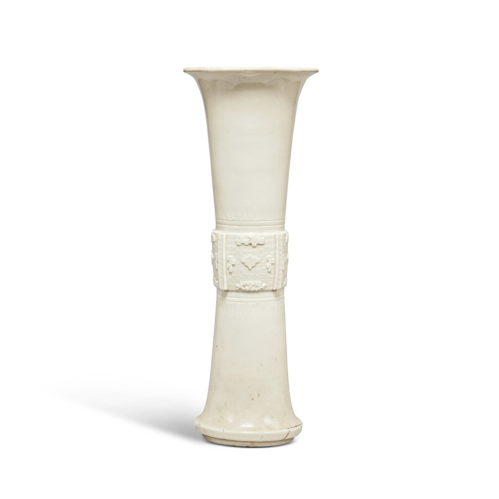View full screen - View 1 of Lot 84. A molded 'Dehua' gu-form vase, Qing dynasty, Kangxi period .