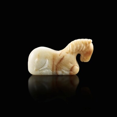 View full screen - View 1 of Lot 3001. A white and russet jade recumbent horse, Six dynasties 六朝 白玉臥馬.