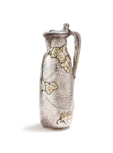 View full screen - View 1 of Lot 405. An American parcel-gilt harmmered silver ewer, Tiffany, New York, circa 1880 | Aiguière couverte en argent et vermeil martelé par Tiffany, New York, vers 1880.