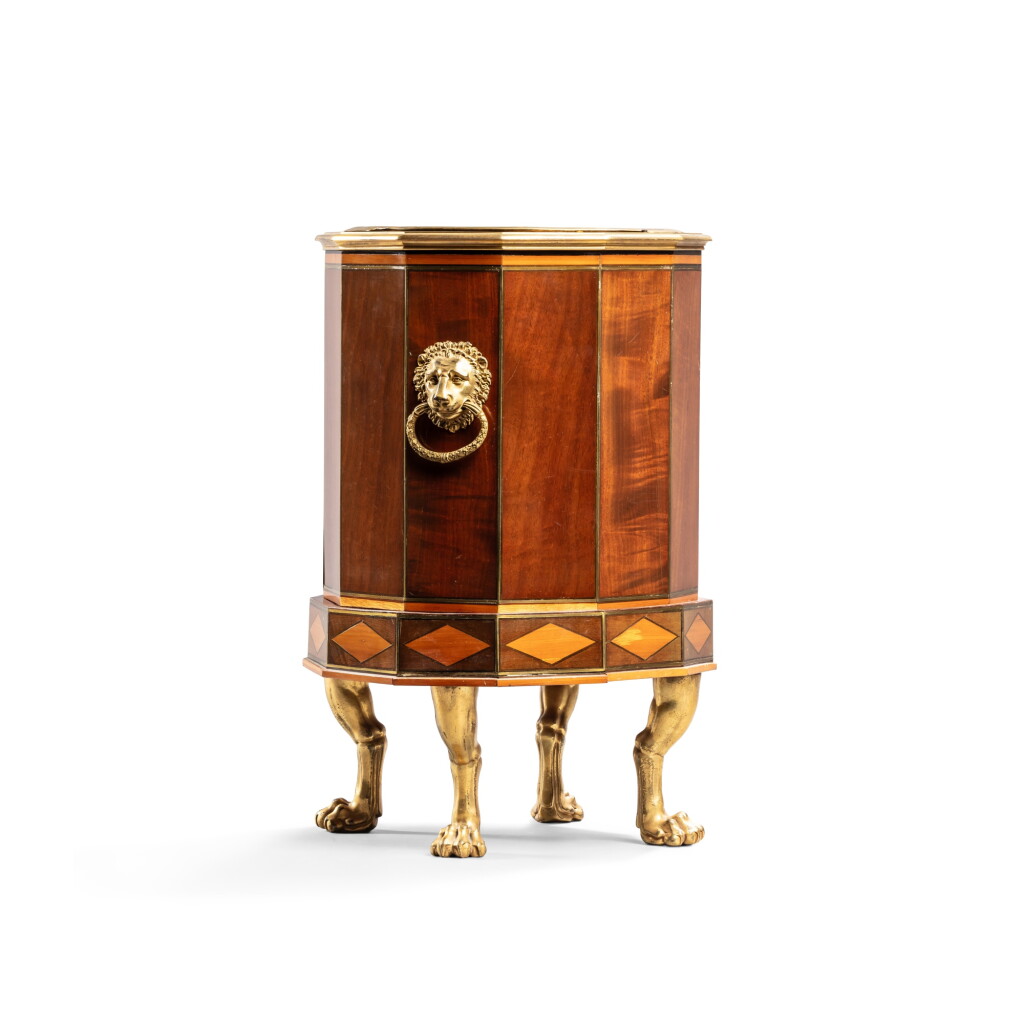 View full screen - View 1 of Lot 44. A Directoire gilt-bronze and gilt-brass mounted mahogany and sycamore veneered polygonal jardinière, by Martin-Guillaume Biennais, Paris, 1795-1799.